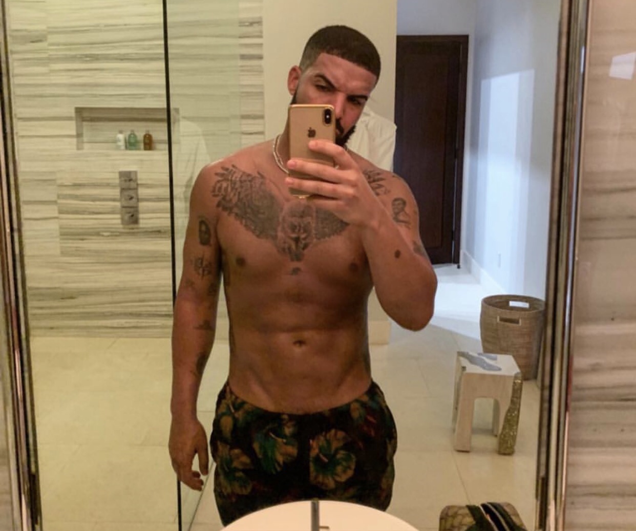 Drake shows off massive chest tattoo Miss Petite Nigeria Blog